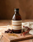 Evera Shampoo No 3 Supherbal Copper Auburn with hibiscus blossoms and henna powder on terracotta, umber backdrop