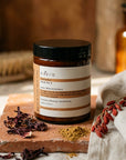 Evera Mask No 3 Supherbal Copper Auburn with hibiscus and henna on terracotta tile, umber backdrop