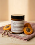 Evera Mask No 2 Moisturising with halved apricots and marshmallow root on dusty-rose linen, warm ivory-peach backdrop